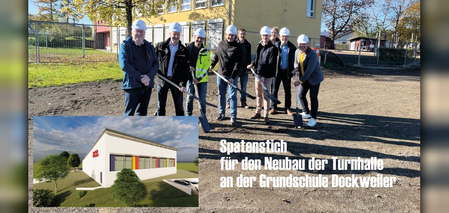 Personen auf dem Grundstück der neuen Turnhalle Dockweiler zum Spatenstich