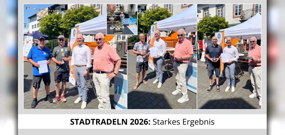 Siegerehrung; Personen mit Pokal in der Hand